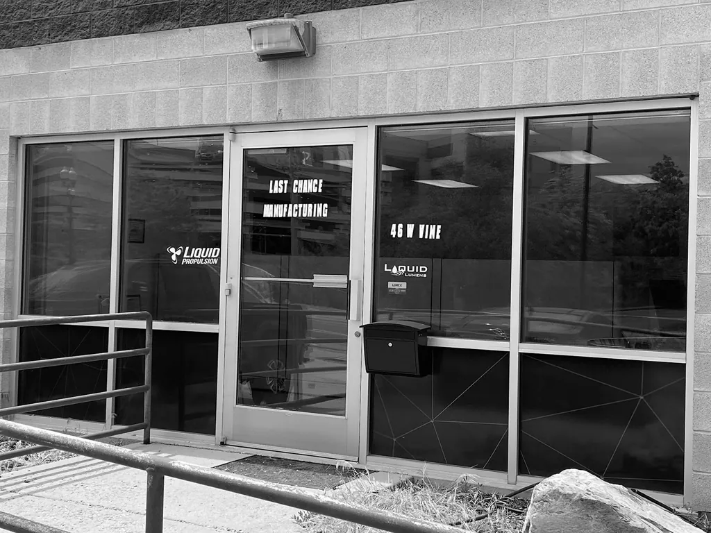 Black-and-white photo of the Last Chance Manufacturing building exterior